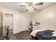 Bedroom featuring neutral colors, a ceiling fan, wood-look floors and a makeup vanity at 13324 W Annika Dr, Litchfield Park, AZ 85340