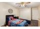 Bedroom features a ceiling fan, wood-look flooring and closet at 13324 W Annika Dr, Litchfield Park, AZ 85340