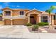 Inviting two-story home showcasing a well-manicured lawn and a spacious three-car garage at 13324 W Annika Dr, Litchfield Park, AZ 85340