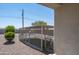 Private dog run area in the backyard with secure metal fencing and gravel surround at 14332 E Bobwhite Way, Scottsdale, AZ 85262