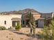 Beautiful southwestern home features stone accents, desert landscaping and mountain views at 14332 E Bobwhite Way, Scottsdale, AZ 85262