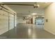 Spacious three car garage features epoxy floors, storage and ample space at 14332 E Bobwhite Way, Scottsdale, AZ 85262
