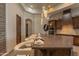 Kitchen island with counter seating and pendant lighting fixtures at 14332 E Bobwhite Way, Scottsdale, AZ 85262
