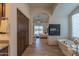 Elegant main bathroom with soaking tub, fireplace, wood cabinets, and access to the main bedroom at 14332 E Bobwhite Way, Scottsdale, AZ 85262