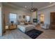 Serene main bedroom featuring a fireplace, sitting area, ensuite bathroom, and neutral color palette at 14332 E Bobwhite Way, Scottsdale, AZ 85262