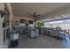 Outdoor kitchen with a built-in grill, bar seating, and a stainless steel cooler at 14332 E Bobwhite Way, Scottsdale, AZ 85262