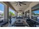 Spacious patio with an outdoor seating area, fire pit, and beautiful mountain views at 14332 E Bobwhite Way, Scottsdale, AZ 85262