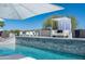 Resort style pool with lounge chairs, a cabana, and beautiful landscaping at 14332 E Bobwhite Way, Scottsdale, AZ 85262