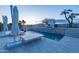 Backyard oasis features a sparkling pool with water feature and resort-style lounge area at 14332 E Bobwhite Way, Scottsdale, AZ 85262
