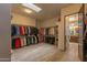 Large walk-in closet with organized shelving and hanging rods, providing ample storage space for clothing and accessories at 14332 E Bobwhite Way, Scottsdale, AZ 85262