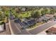 Stunning aerial perspective of a home with a backyard pool, palm trees, and a golf course view at 1509 W Kiowa Ave, Mesa, AZ 85202