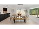 Open concept dining room with large window and view of front yard at 1509 W Kiowa Ave, Mesa, AZ 85202