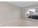 Well-lit empty room with marble floors and a large window at 1509 W Kiowa Ave, Mesa, AZ 85202