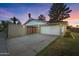 Exterior showcases a gated driveway, two-car garage, and updated front facade at 1509 W Kiowa Ave, Mesa, AZ 85202