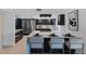 Modern kitchen features sleek cabinetry, stainless steel appliances, and island seating at 1509 W Kiowa Ave, Mesa, AZ 85202