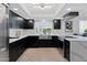 Bright kitchen with black cabinetry, stainless steel appliances, a farmhouse sink, and large windows with backyard views at 1509 W Kiowa Ave, Mesa, AZ 85202