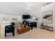 Open-concept living room features modern lighting, elegant furniture, and sleek wet bar at 1509 W Kiowa Ave, Mesa, AZ 85202
