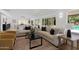Bright and airy living room with couches, coffee table and access to pool at 1509 W Kiowa Ave, Mesa, AZ 85202