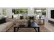 Cozy living room showcasing stylish furniture, a modern coffee table, and outdoor views at 1509 W Kiowa Ave, Mesa, AZ 85202