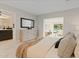 Tranquil main bedroom with walk-in access to ensuite bathroom and views of the refreshing pool and living room at 1509 W Kiowa Ave, Mesa, AZ 85202