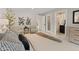 Bright main bedroom with decorative art, accent chairs, and an ensuite bathroom at 1509 W Kiowa Ave, Mesa, AZ 85202