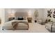 Nicely staged main bedroom with upholstered headboard and seating area at 1509 W Kiowa Ave, Mesa, AZ 85202