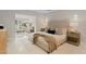 Relaxing main bedroom with a king bed, neutral colors, and access to the bright and airy living room at 1509 W Kiowa Ave, Mesa, AZ 85202