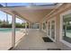 Covered patio adjacent to a pool with exterior doors to interior and a concrete floor at 1509 W Kiowa Ave, Mesa, AZ 85202