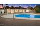 A backyard pool with a patio and string lights creates a relaxing outdoor space at 1509 W Kiowa Ave, Mesa, AZ 85202