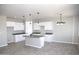 Modern kitchen with granite countertops, stainless steel faucet and modern pendant lighting at 15128 S Country Club Dr, Arizona City, AZ 85123