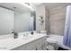 Updated bathroom with a modern vanity, bright lighting, and shower with neutral tile at 15610 N 29Th St # 3, Phoenix, AZ 85032