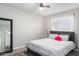 Bright bedroom featuring a full-length mirror and window with lots of natural light at 15610 N 29Th St # 3, Phoenix, AZ 85032
