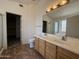 Double sink bathroom vanity with separate toilet room at 16784 W Polk St, Goodyear, AZ 85338