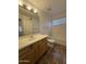 Bathroom with sink, toilet, shower and natural light at 16784 W Polk St, Goodyear, AZ 85338