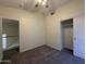 Bedroom with closet and neutral colored carpet at 16784 W Polk St, Goodyear, AZ 85338