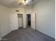 Bedroom with carpet, closet and connecting hallway at 16784 W Polk St, Goodyear, AZ 85338