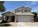 Charming two-story home with a well-maintained front yard and tile roof at 16784 W Polk St, Goodyear, AZ 85338
