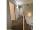 Carpeted hallway leading to bedrooms at 16784 W Polk St, Goodyear, AZ 85338