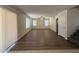 Spacious living area with new hardwood flooring, ceiling fan and abundant light at 16784 W Polk St, Goodyear, AZ 85338