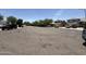 View of a quiet street with well-maintained homes and parked cars at 16784 W Polk St, Goodyear, AZ 85338