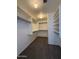 Walk-in closet offers ample space and shelving for wardrobe storage at 16784 W Polk St, Goodyear, AZ 85338