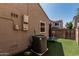 Backyard featuring a small, artificial grass yard with a solar panel unit at 1700 S Martingale Rd, Gilbert, AZ 85295