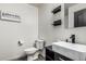 Modern bathroom featuring a vessel sink, wood-look floors, and neutral paint at 1700 S Martingale Rd, Gilbert, AZ 85295