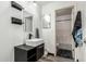 Modern bathroom featuring a vessel sink, wood-look floors, and bathtub with shower at 1700 S Martingale Rd, Gilbert, AZ 85295