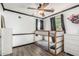 Cozy bedroom with bunk beds, wood-look floors, and neutral tones at 1700 S Martingale Rd, Gilbert, AZ 85295