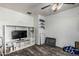 Bonus room with a TV, neutral paint, and wood-look floors at 1700 S Martingale Rd, Gilbert, AZ 85295