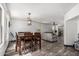 Bright dining area featuring modern lighting and seamless connectivity to the living room at 1700 S Martingale Rd, Gilbert, AZ 85295