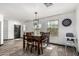 Inviting dining room features a stylish light fixture and great natural light at 1700 S Martingale Rd, Gilbert, AZ 85295