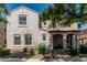 Exterior view of a two-story home with arched porch and well-maintained landscaping at 1700 S Martingale Rd, Gilbert, AZ 85295