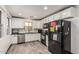 Well-lit kitchen with stainless steel appliances and a view of the backyard at 1700 S Martingale Rd, Gilbert, AZ 85295